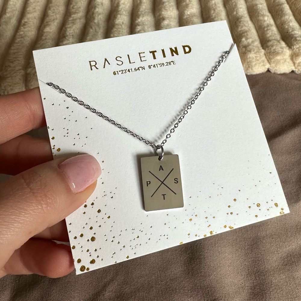 Customized initial necklace with engraved initials A , P, T, S in silver